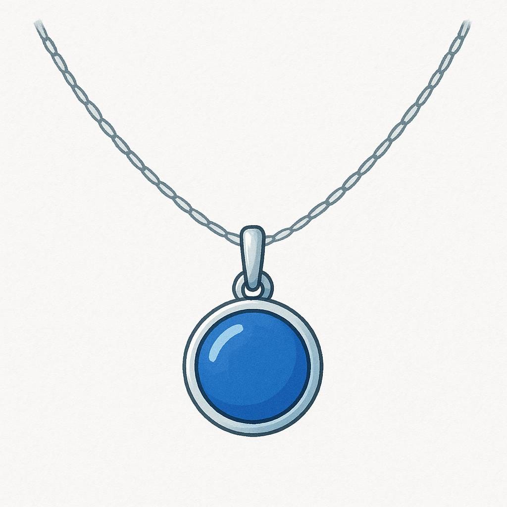 A simple silver chain necklace with a small, circular blue pendant, displayed against a soft background.